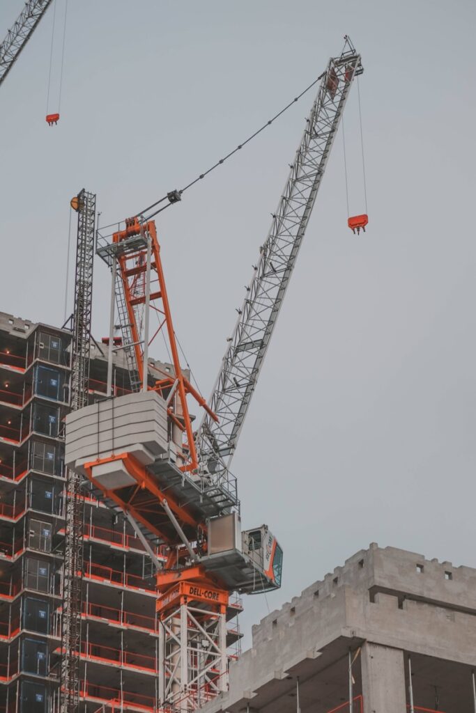 a crane that is on top of a building, captured by a UK Acoustics Consultancy.
