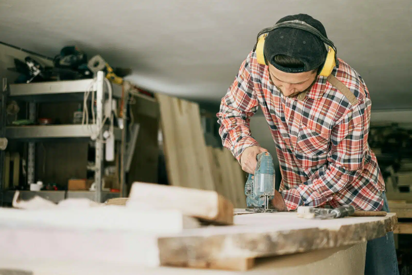 Photo by Ivan Samkov A skilled carpenter uses a power drill in a well-organized woodworking workshop. The Control of Noise at Work Regulations 2005
