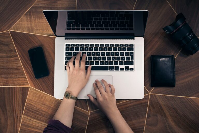 person using MacBook Pro on the new polaris acoustics website, looking for noise survey services and acoustic assessments for planning applications, bs8233, bs4142 and bs5228.