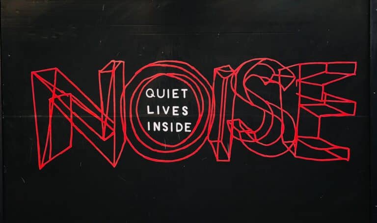 Noise pollution in residential areas and developments. text over black background representative of BS 8233, BS 4142 and BS 5228 noise assessments.