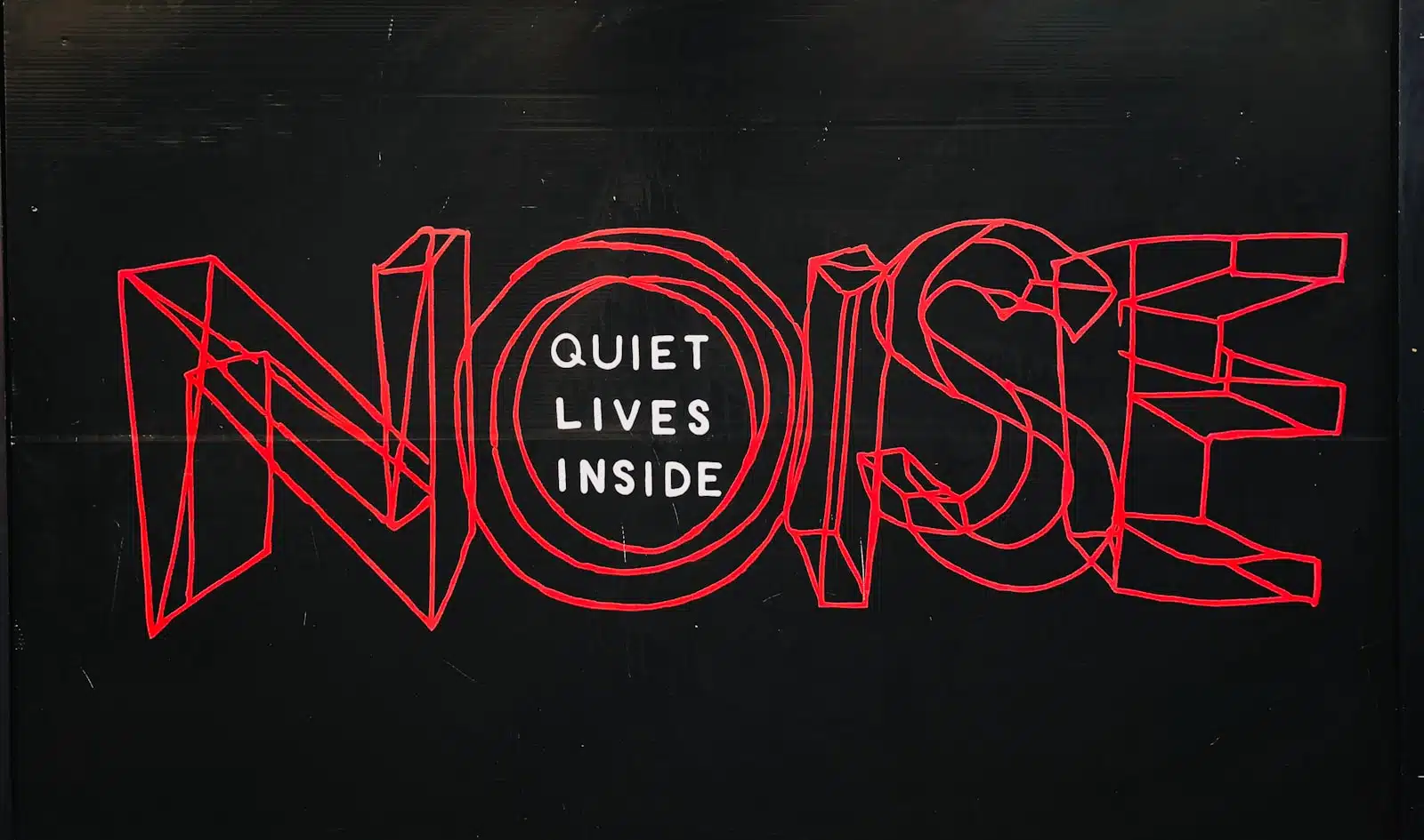Photo by Jon Tyson Noise pollution in residential areas and developments. text over black background representative of BS 8233, BS 4142 and BS 5228 noise assessments.