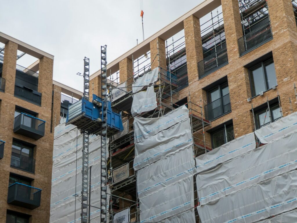 a building with scaffolding on the side of it, seeing a development go up after a bs8233 noise assessment.