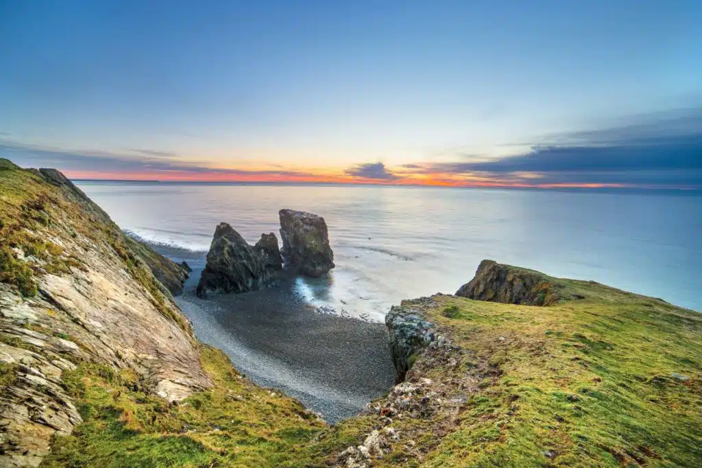 green island with blue calm sea noise consultants in Wales
