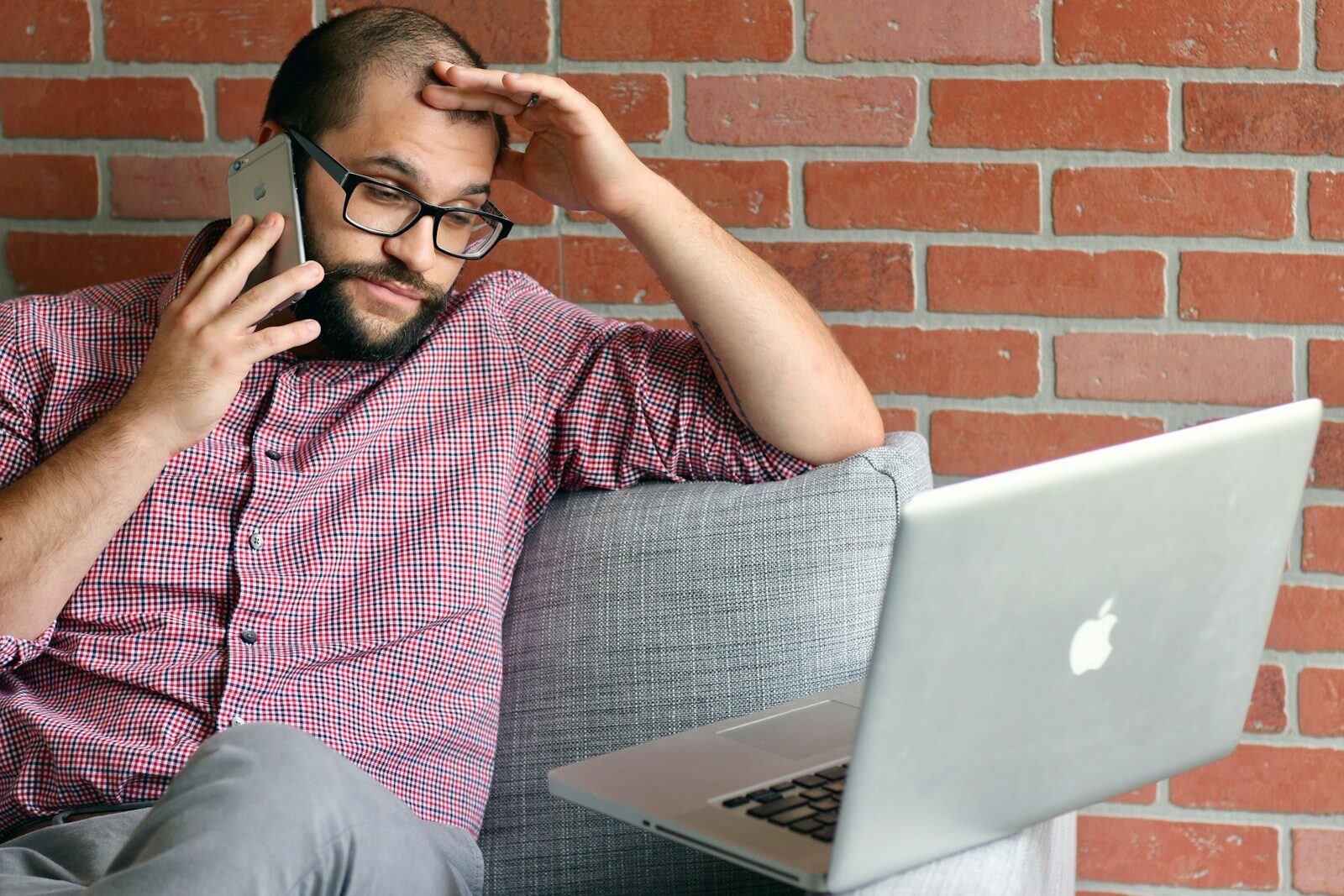 a man with a laptop frustrated by 7 noise issues that are affecting his planning application.